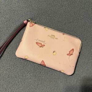 Pink butterfly coach wristlet